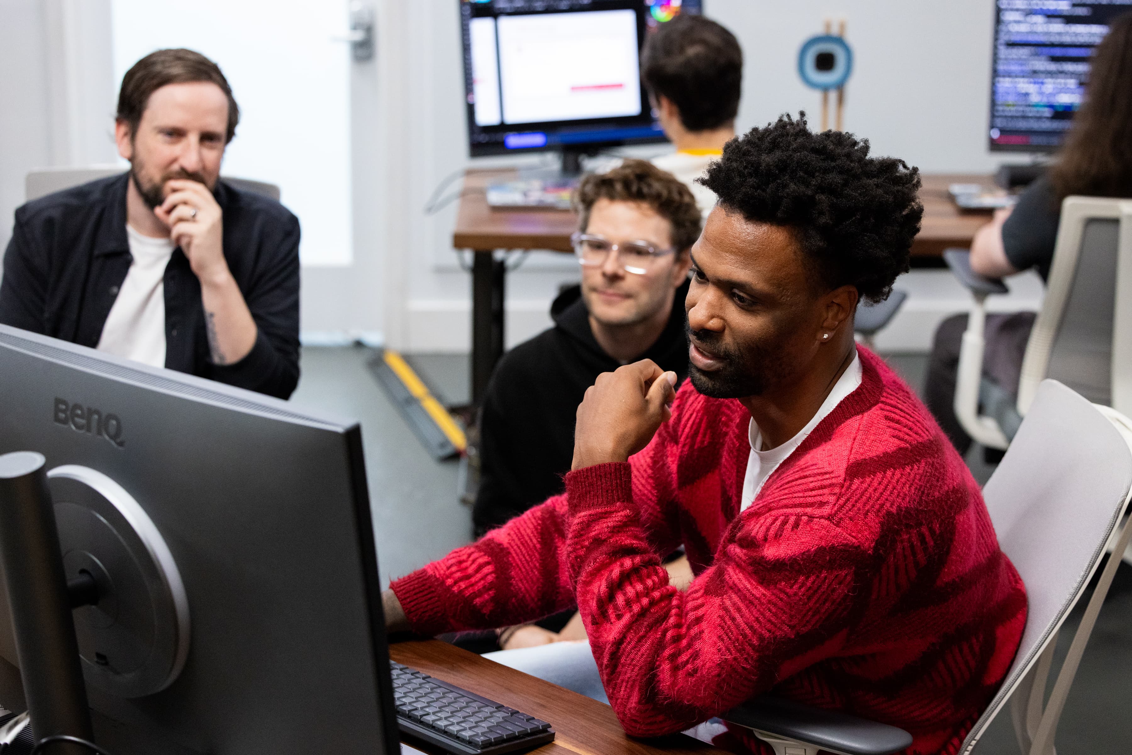 Builders watching a run come together on a monitor