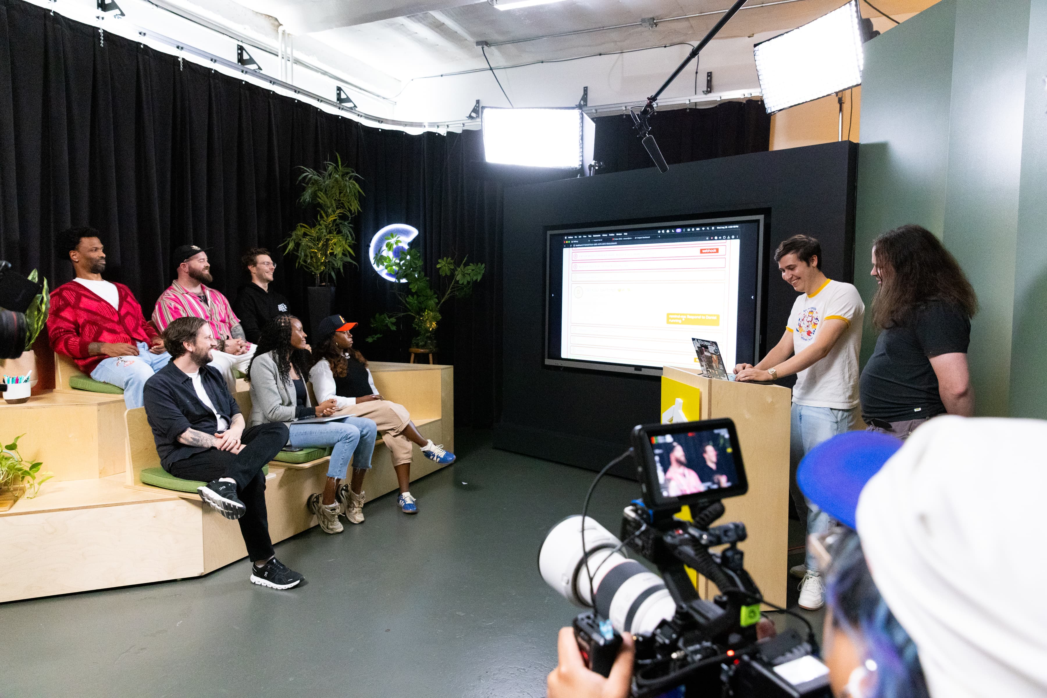 Teams watching a demo on the CodeTV set