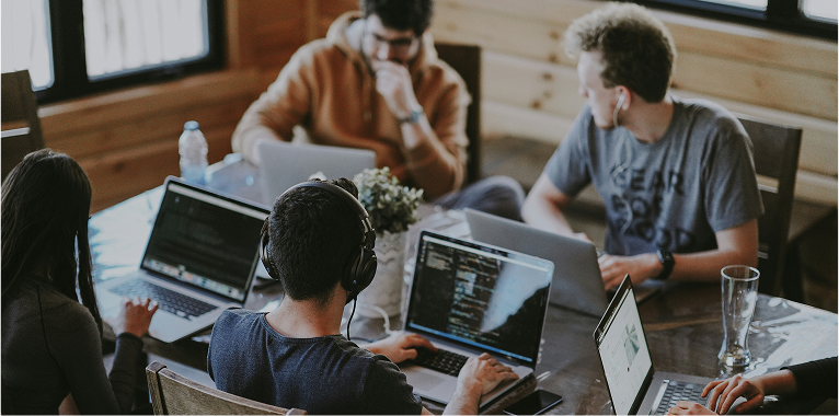 Developers working together at an Inngest community event.